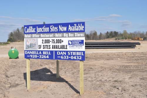 What will be the city's part in building/maintaining Cadillac Junction?